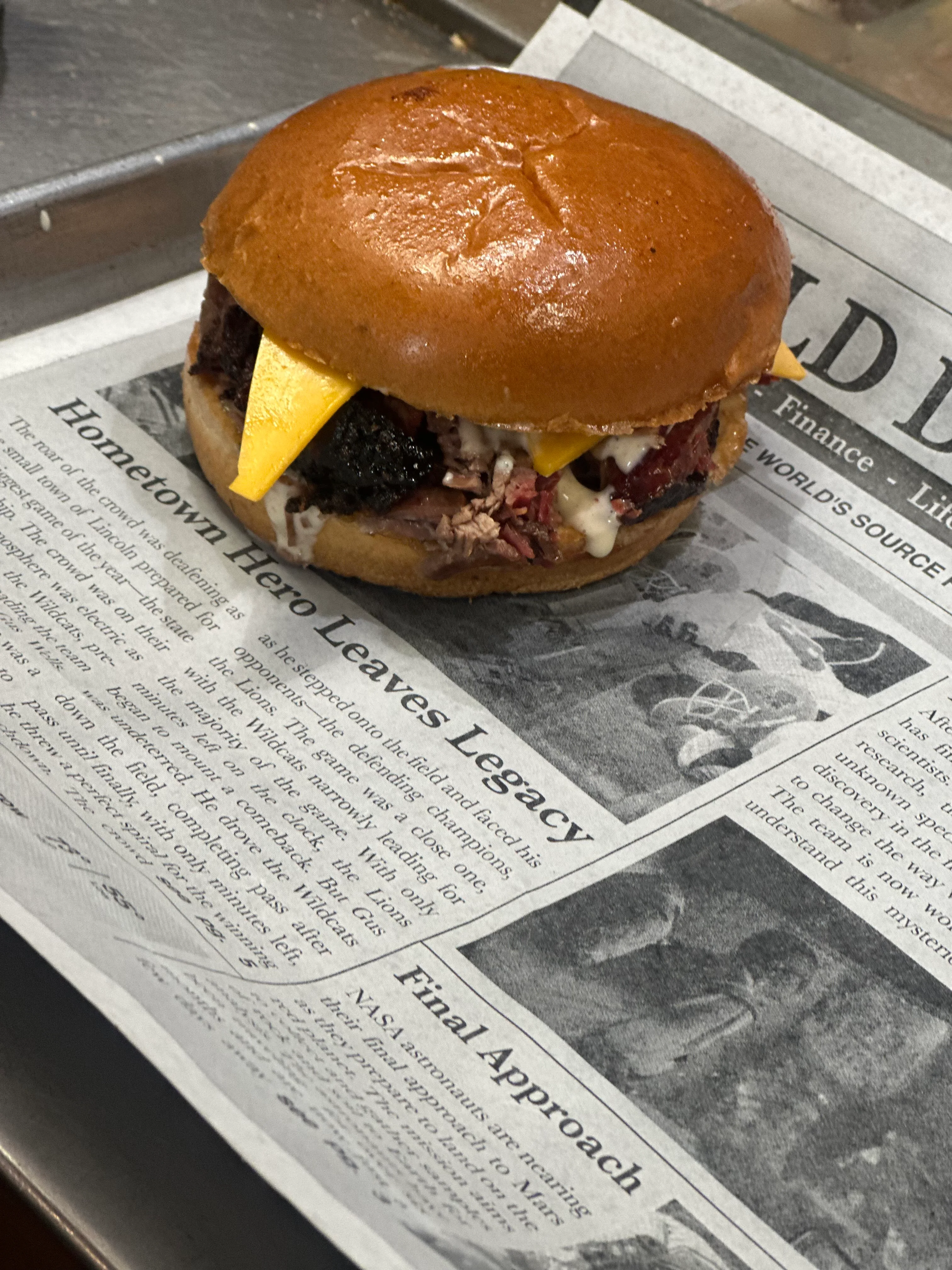 Smoked brisket sandwich on a brioche bun