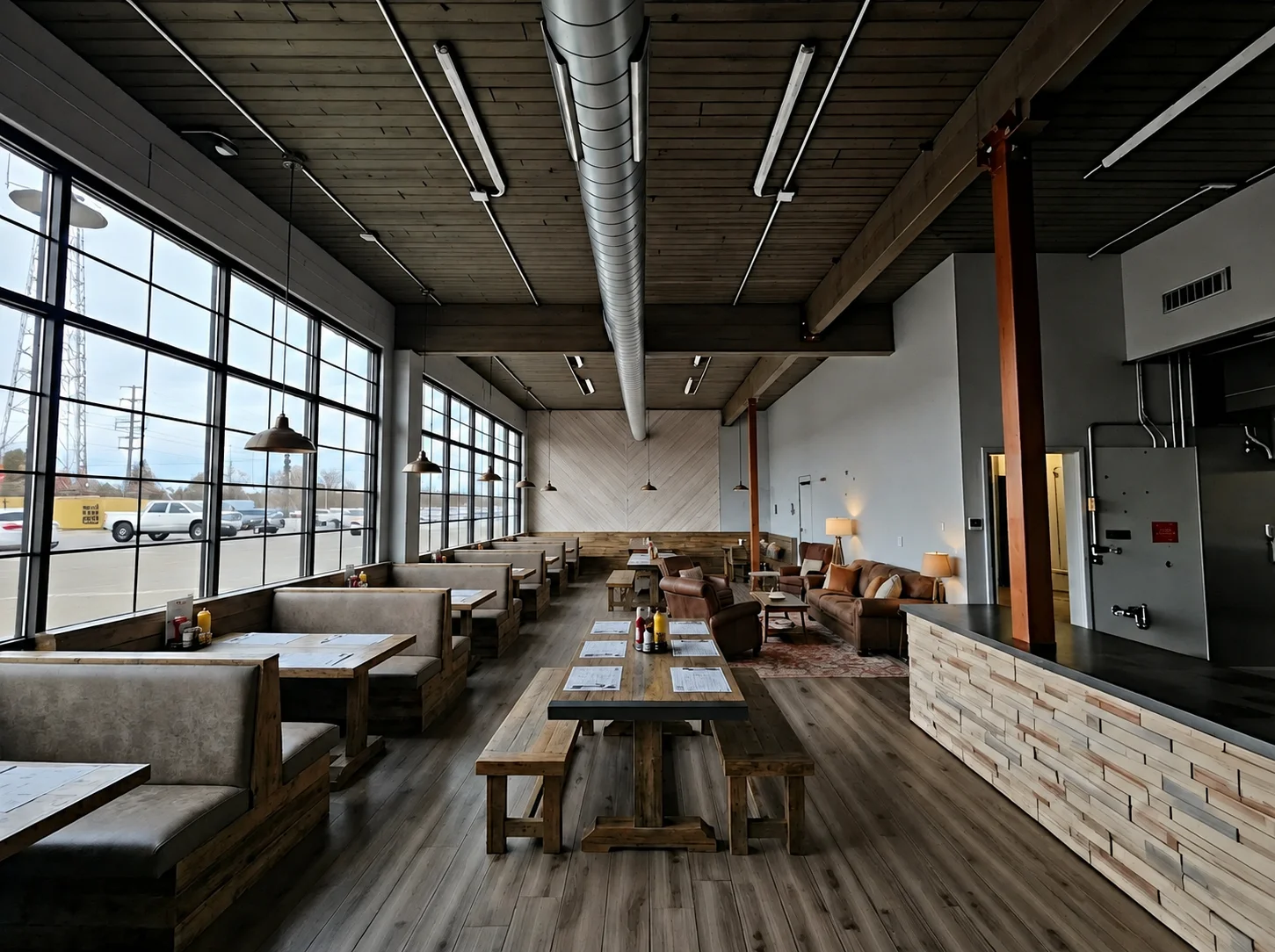 Modern restaurant interior with large windows and rustic wooden furniture