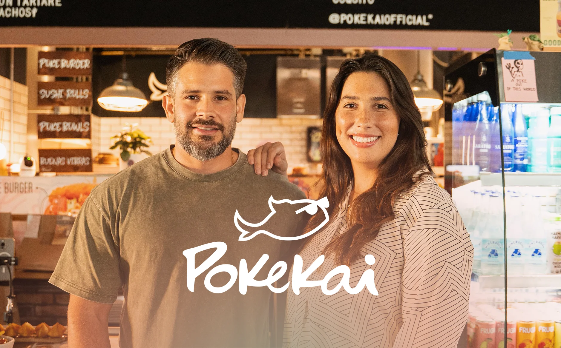 Owners of Pokekai restaurant smiling in their vibrant eatery