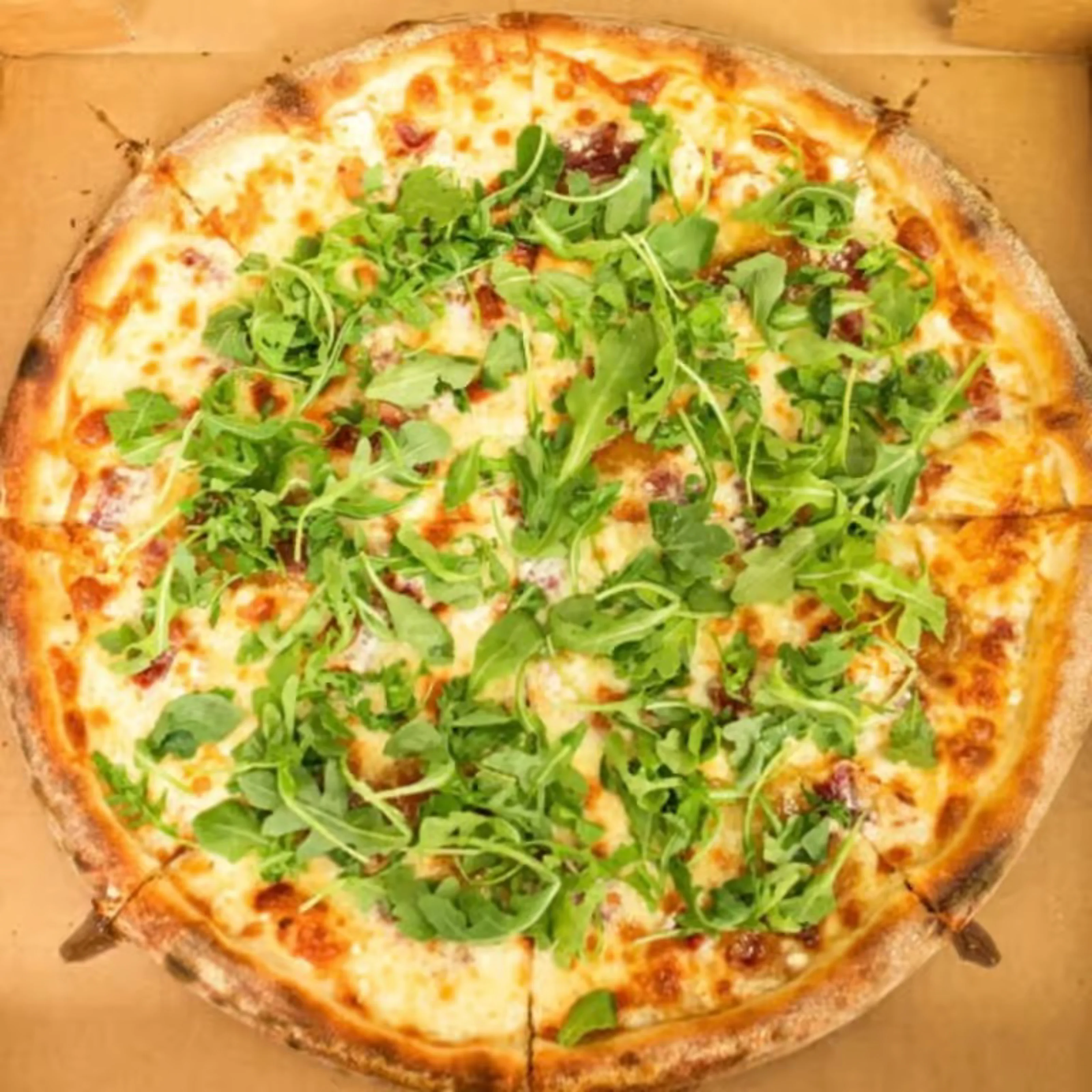 Delicious pizza with fresh toppings on a wooden table