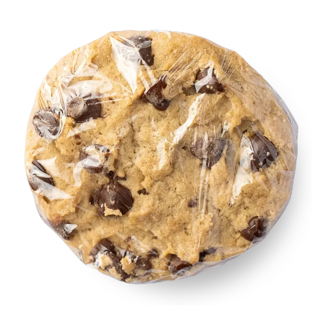 Two chocolate chip cookies, one larger than the other, served on a white plate.