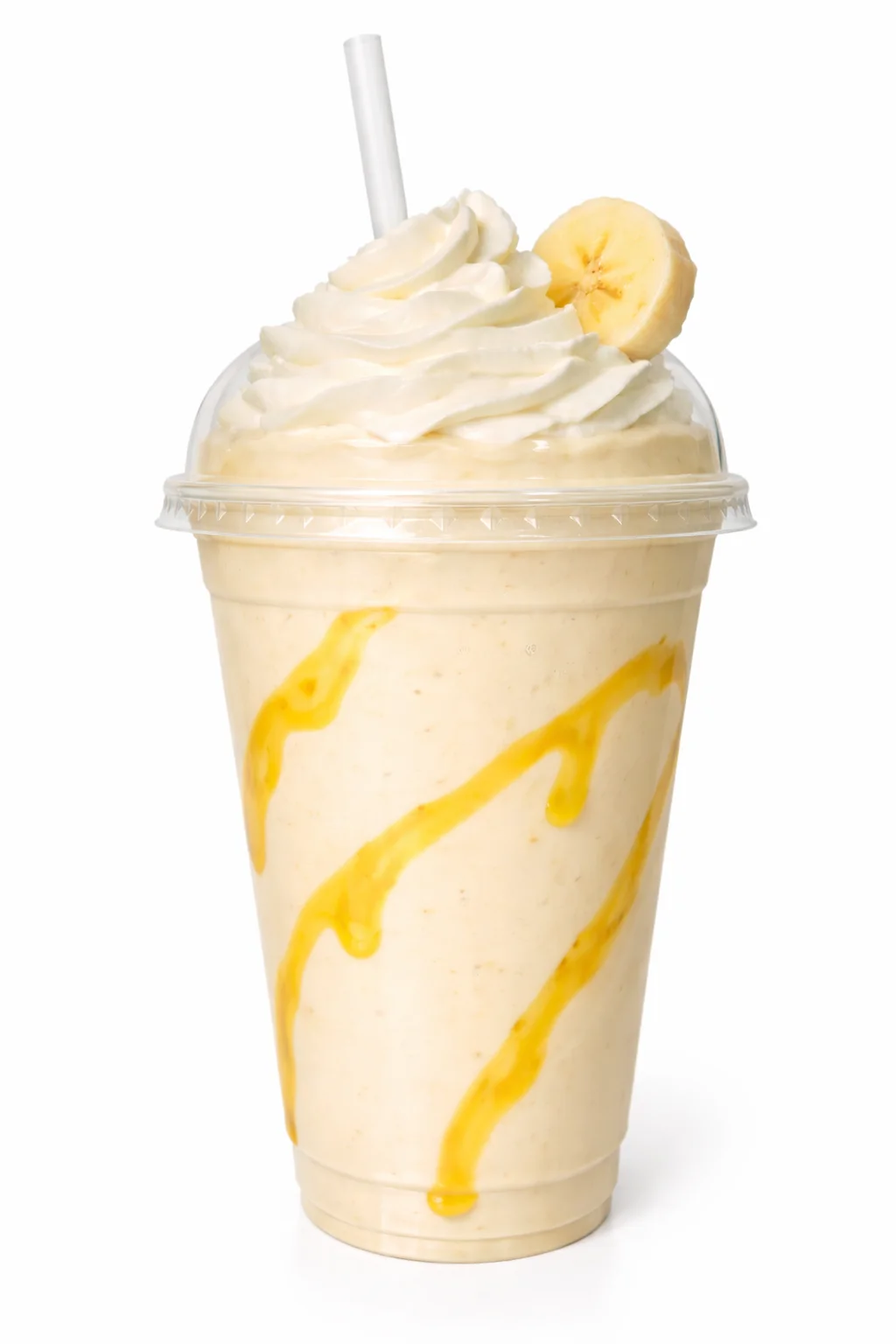 A smooth banana shake topped with whipped cream and a slice of banana, in a clear cup.