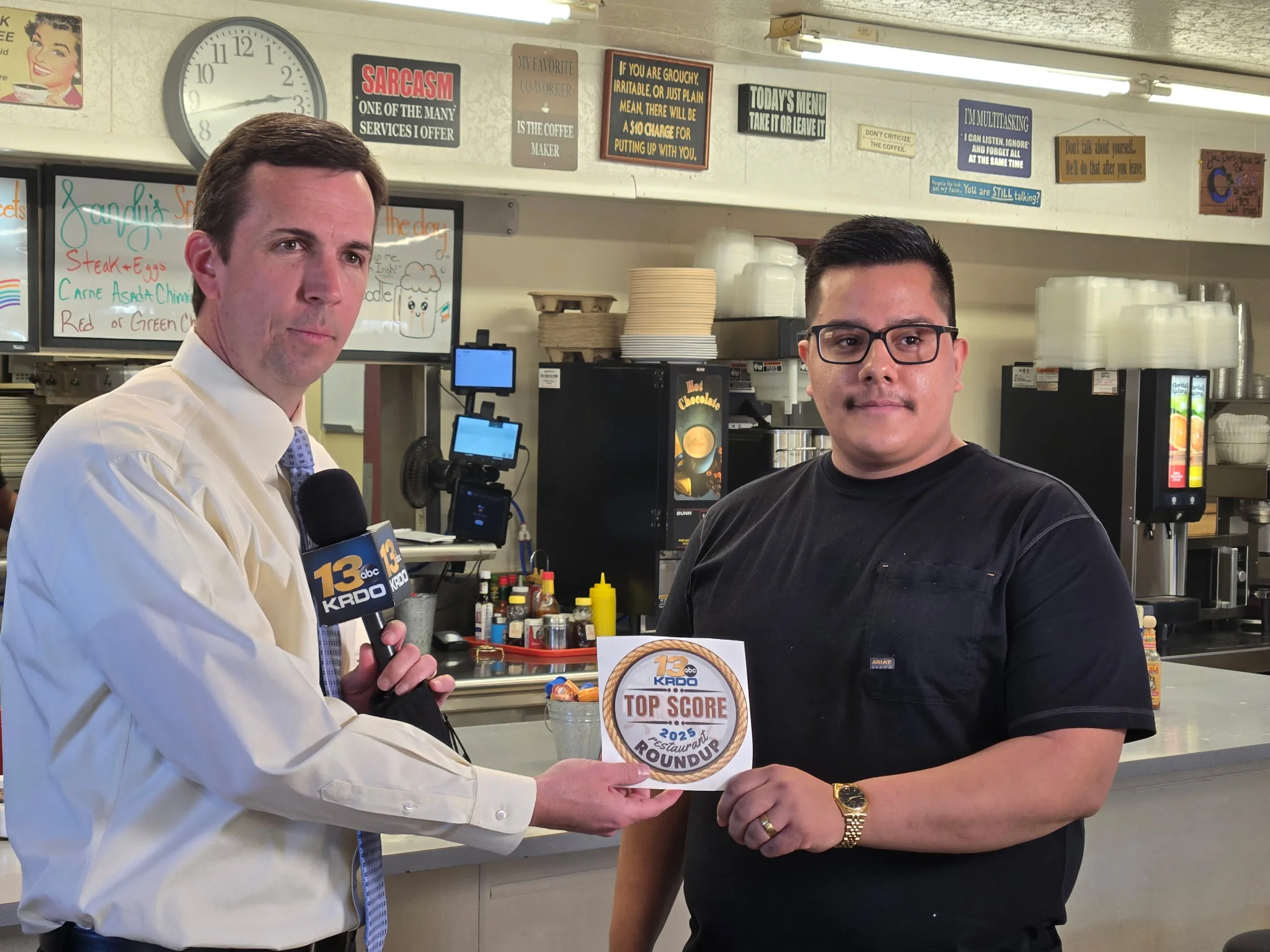 Restaurant award presentation in a cozy diner setting