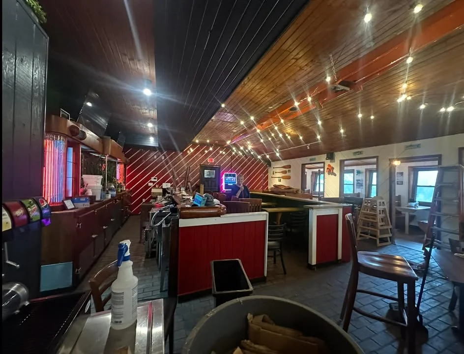 Cozy restaurant interior with warm lighting and wooden accents
