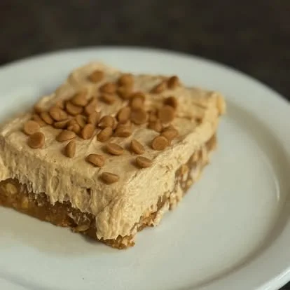 Creamy peanut butter dessert bar with butterscotch topping