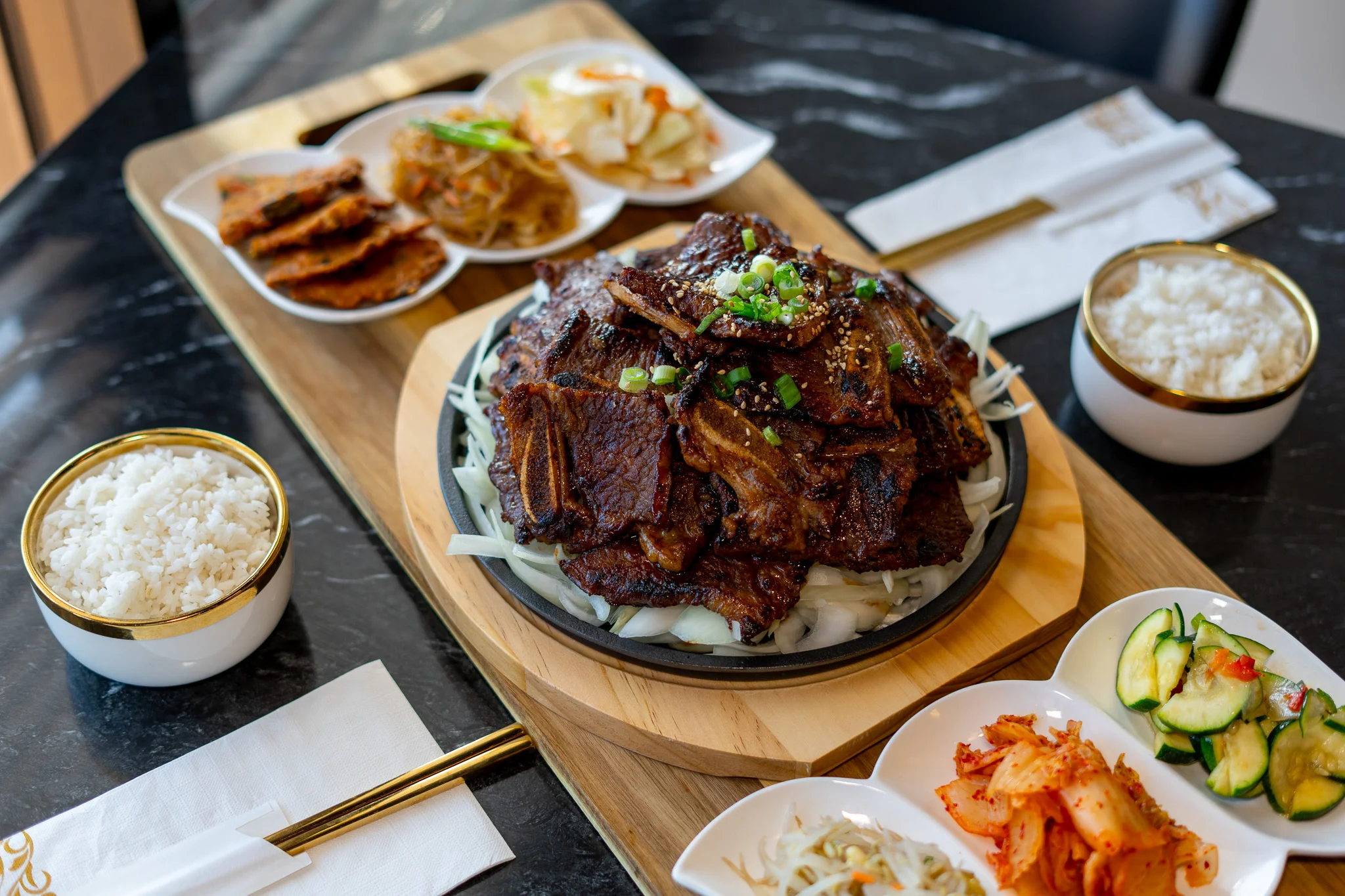 Korean galbi beef short ribs served with rice and side dishes