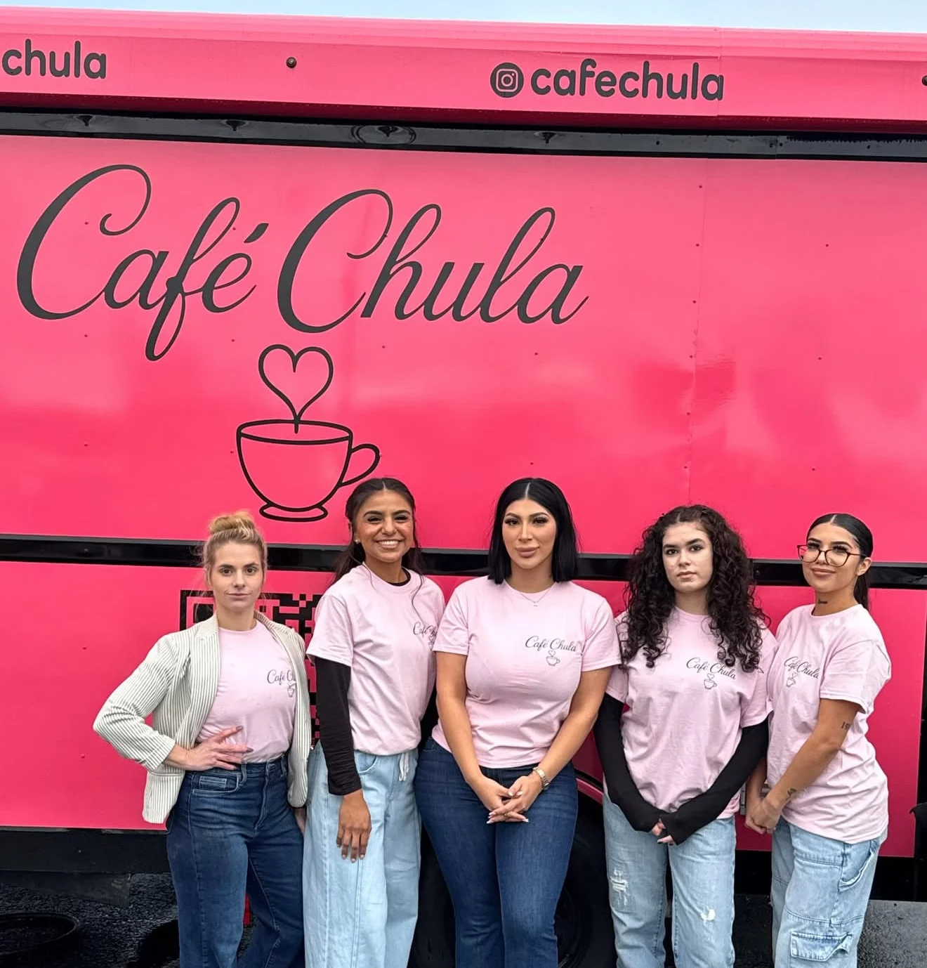 Café Chula staff in pink shirts by food truck