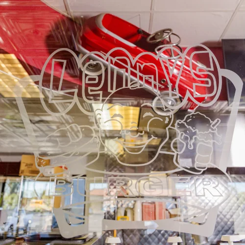 Lenny's Burger restaurant logo on glass door