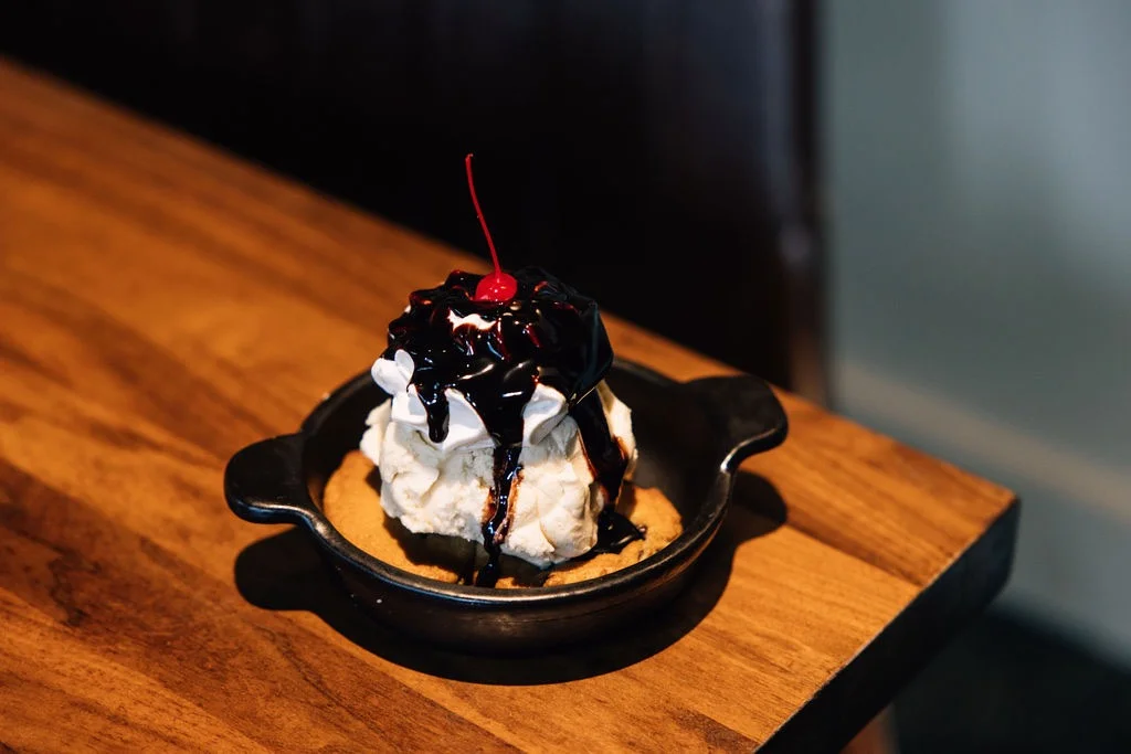Warm chocolate chip cookie skillet topped with ice cream