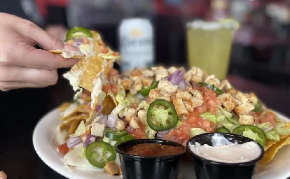 Loaded nachos with chicken and toppings
