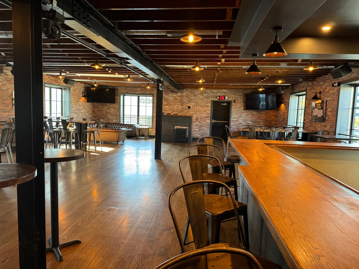 Cozy restaurant interior with exposed brick and warm lighting
