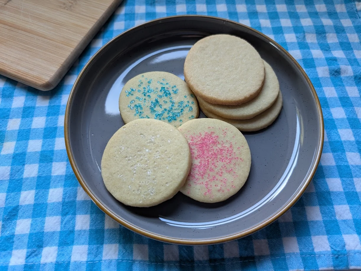 Colorful sugar cookies on a gray plate