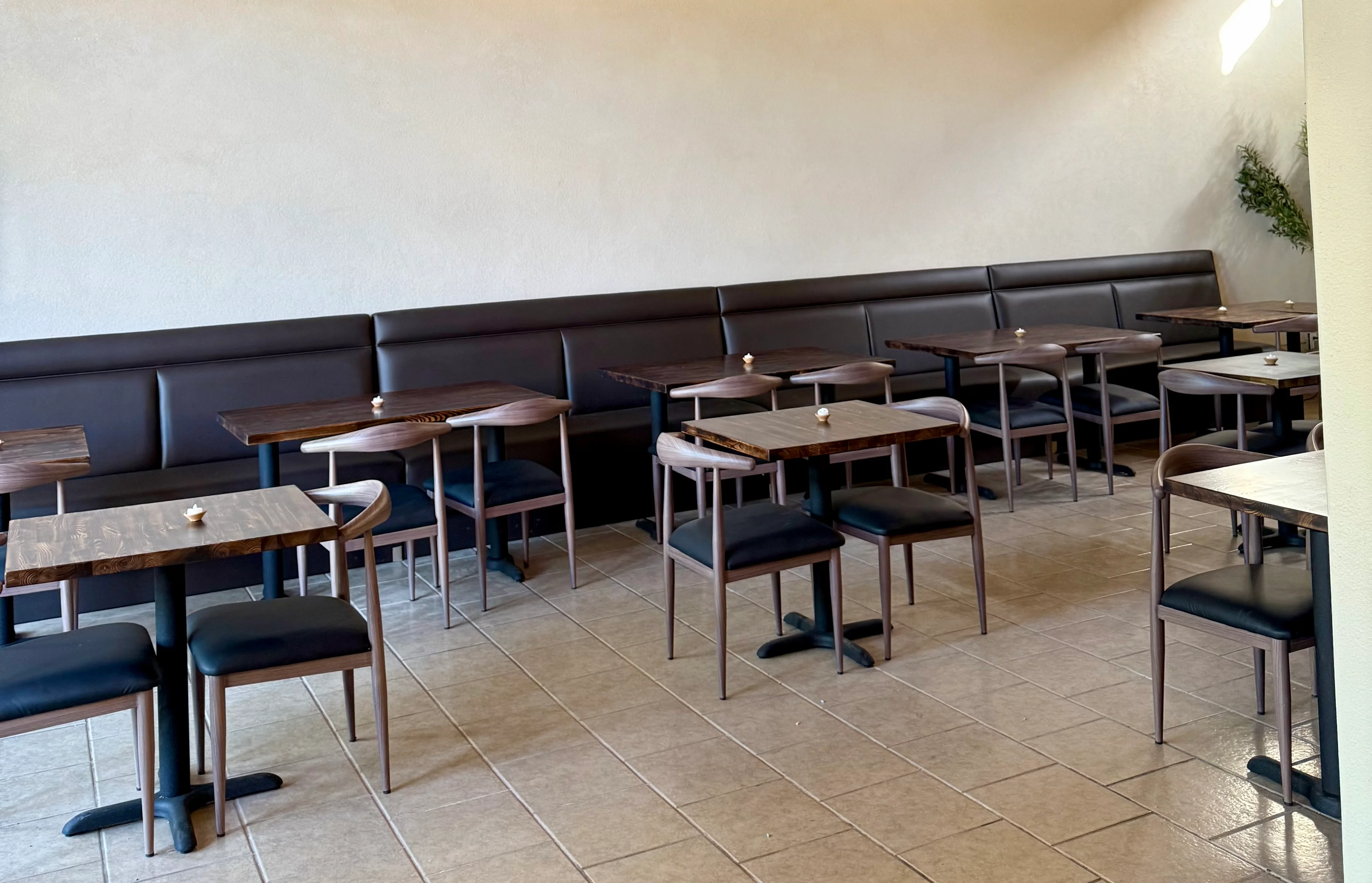 Modern restaurant interior with stylish seating and pendant lighting