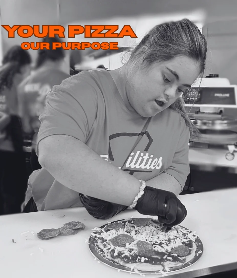 Crafting a personalized pizza with fresh toppings