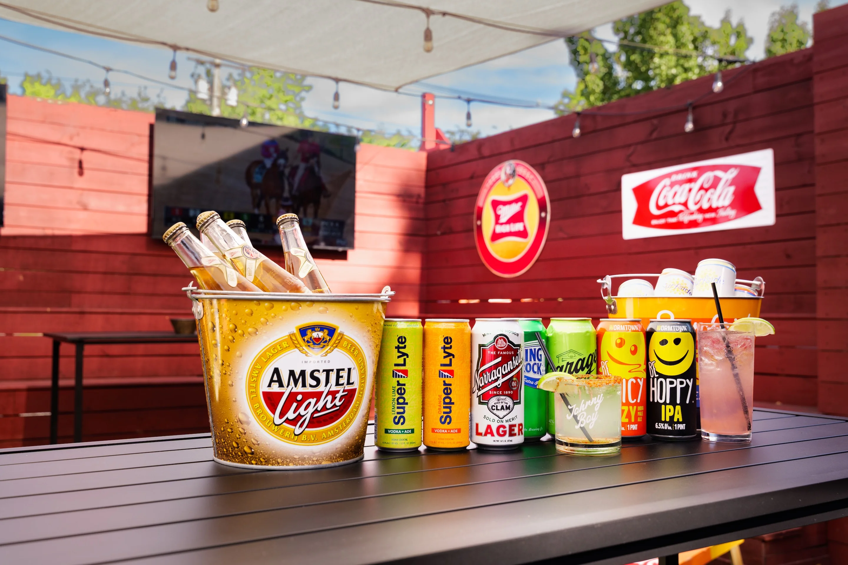 Variety of beverages in a vibrant outdoor bar setting