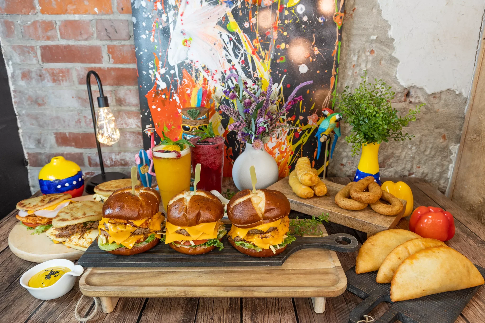 Colorful platter of gourmet burgers and Latin snacks