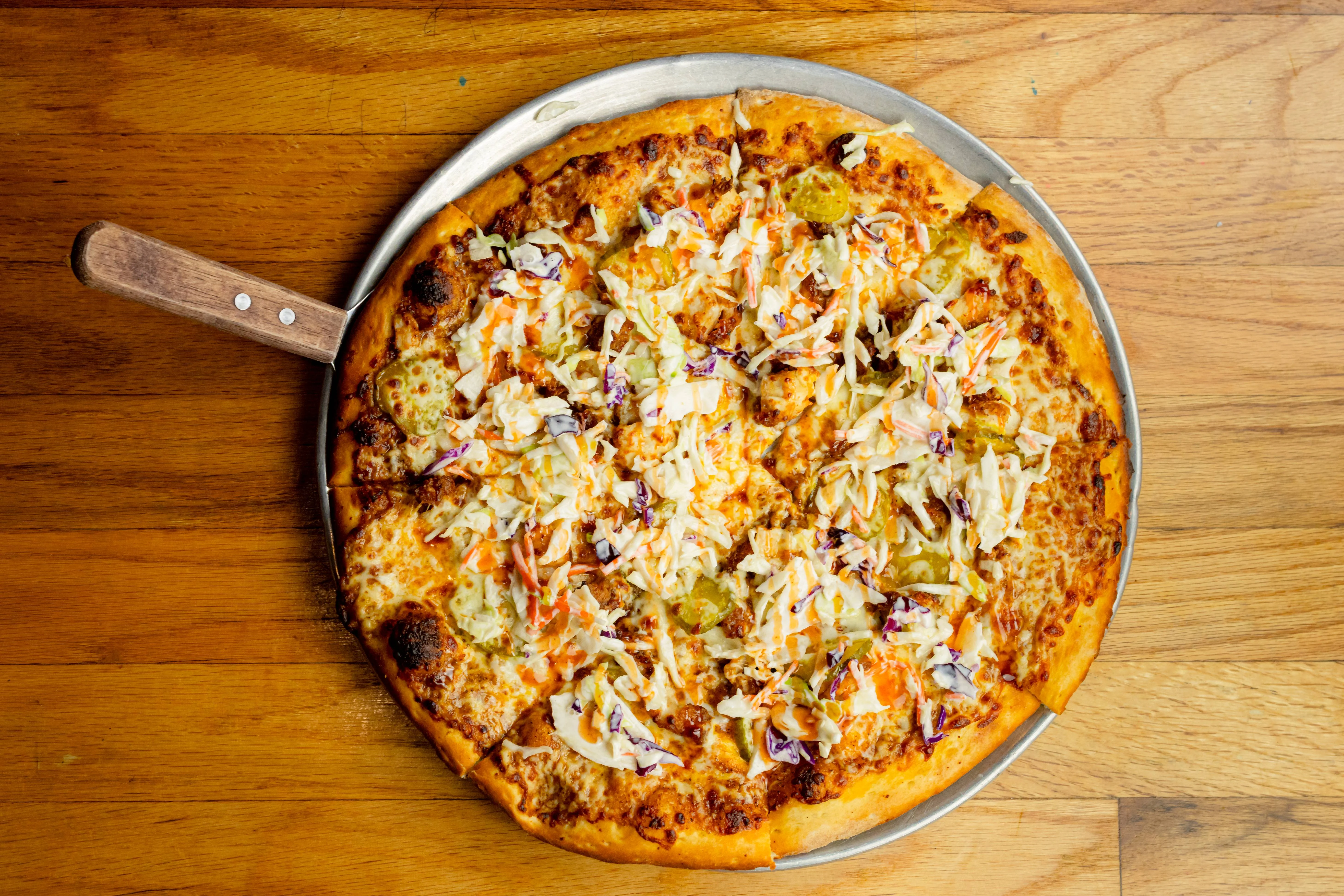 Delicious Mexican-style pizza with beef and dipping sauce