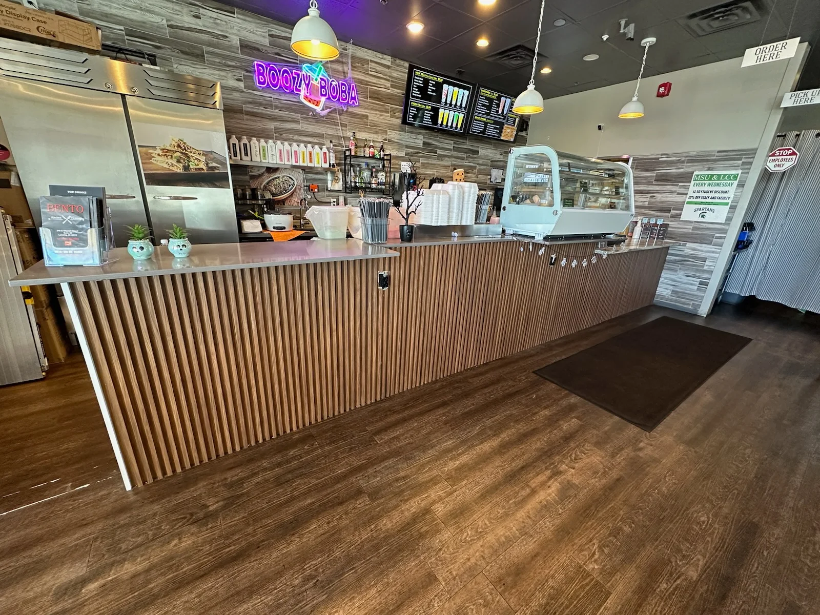 Modern restaurant counter with boba tea and snacks
