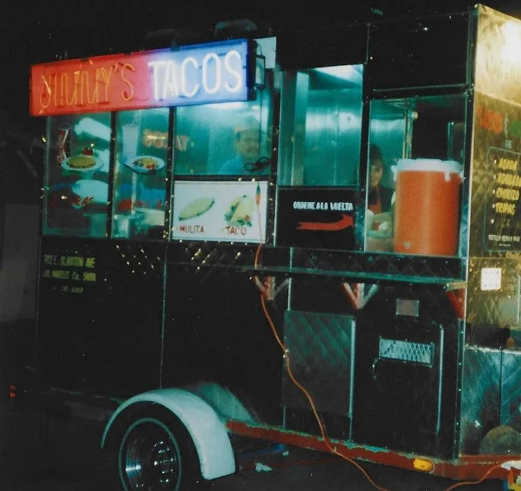 Colorful taco truck serving authentic Mexican street tacos