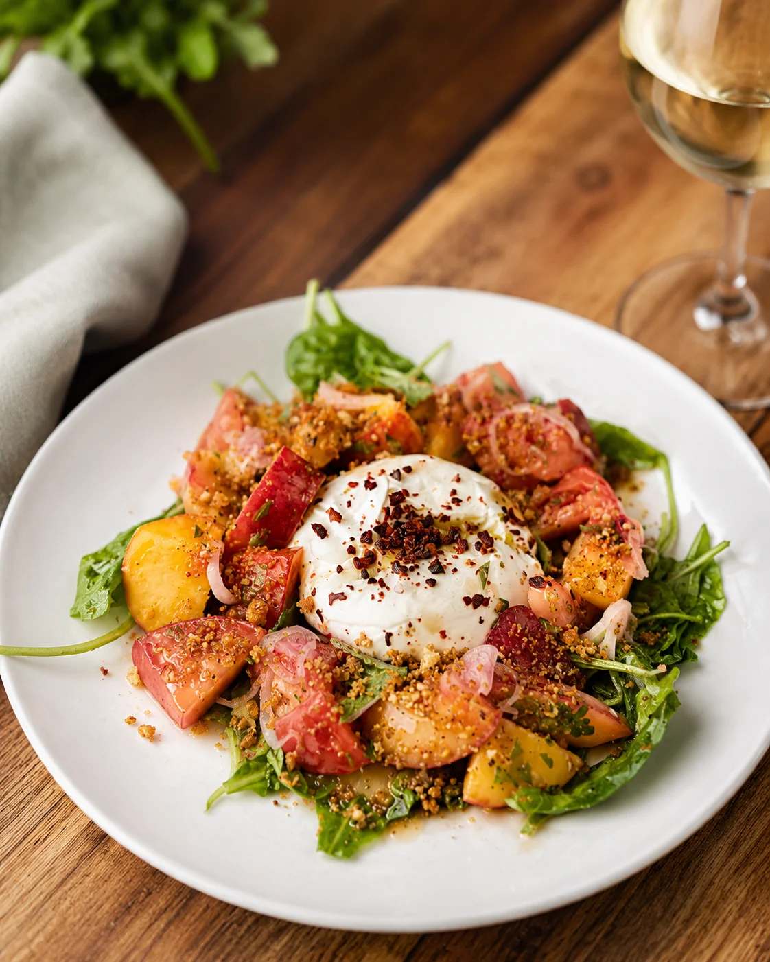 Fresh burrata salad with heirloom tomatoes and arugula