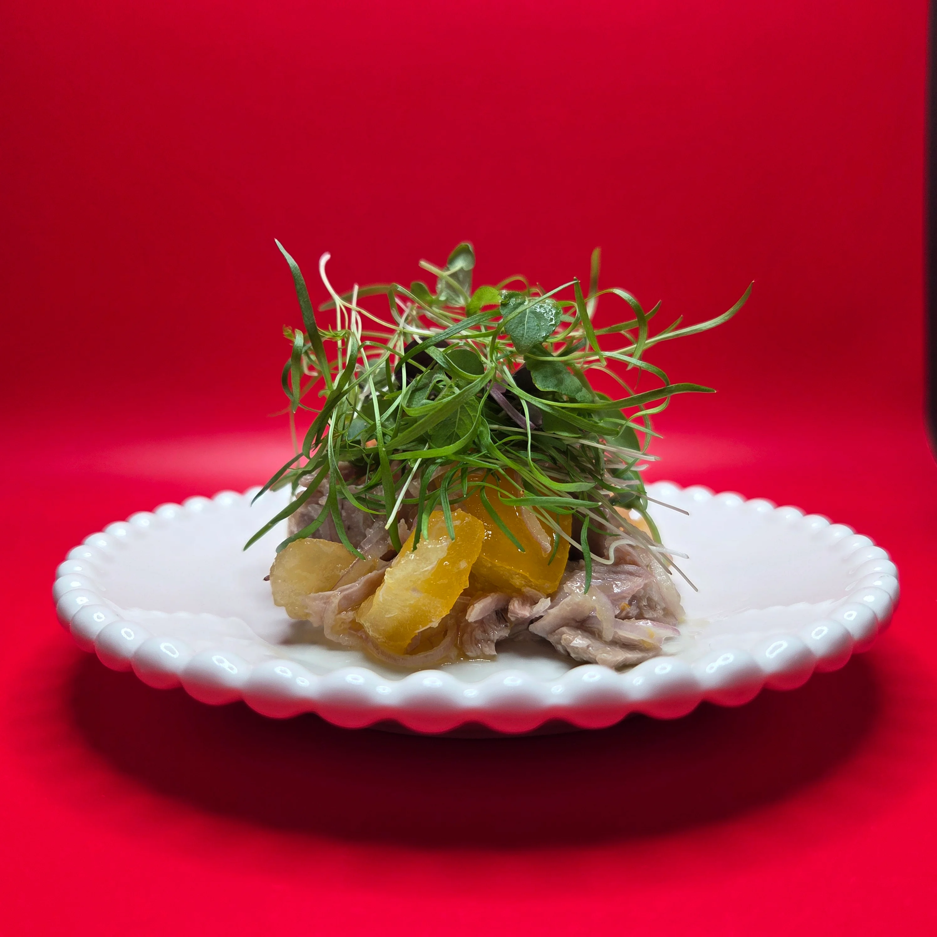 Artistic presentation of Vietnamese salad with herbs and citrus