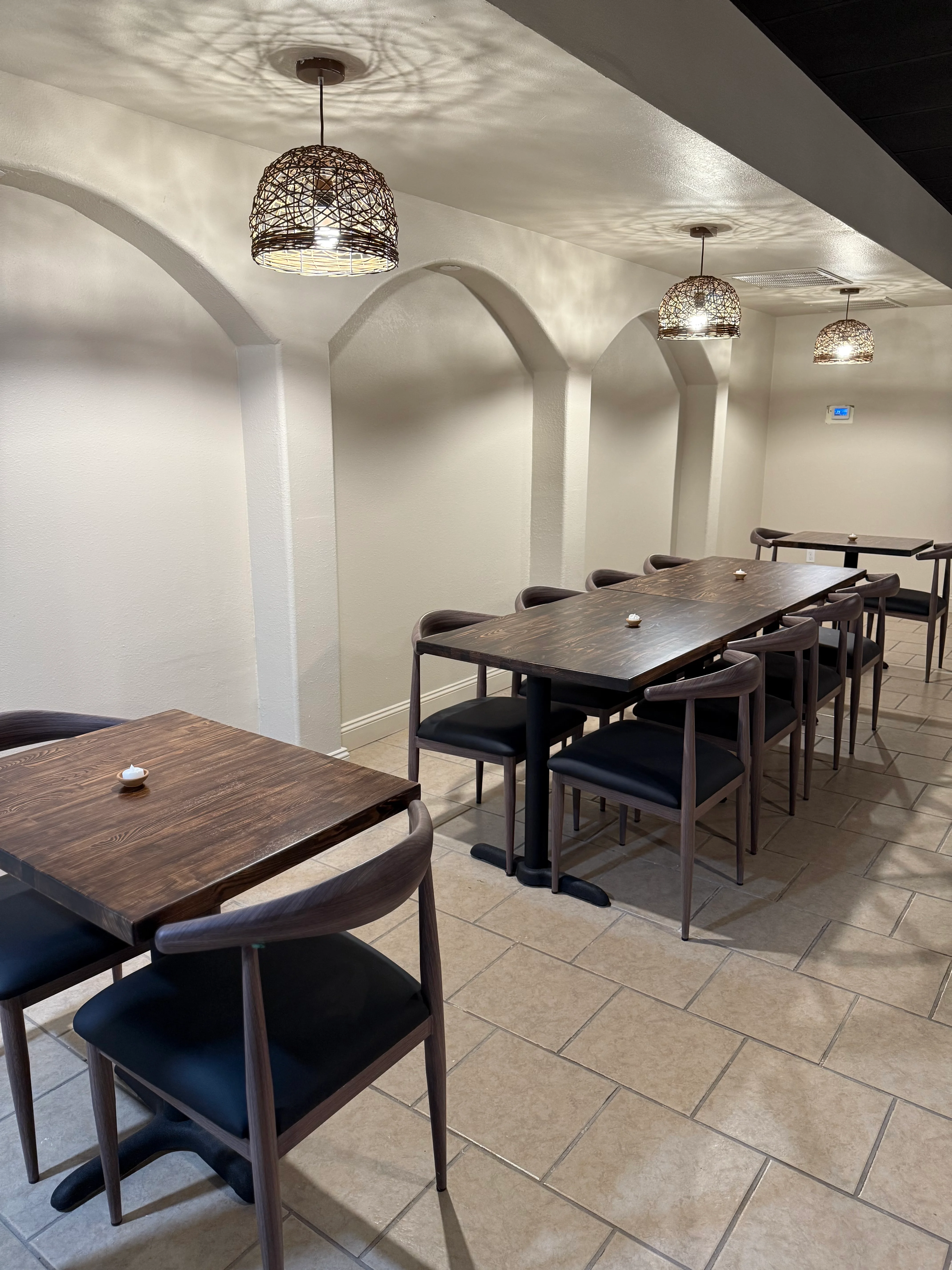 Cozy restaurant interior with modern wooden tables and warm lighting