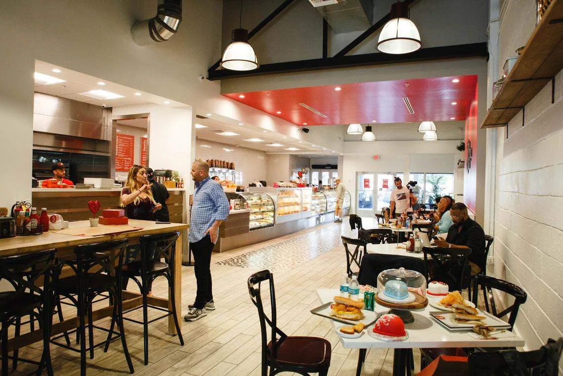Modern restaurant interior with cozy seating and display cases