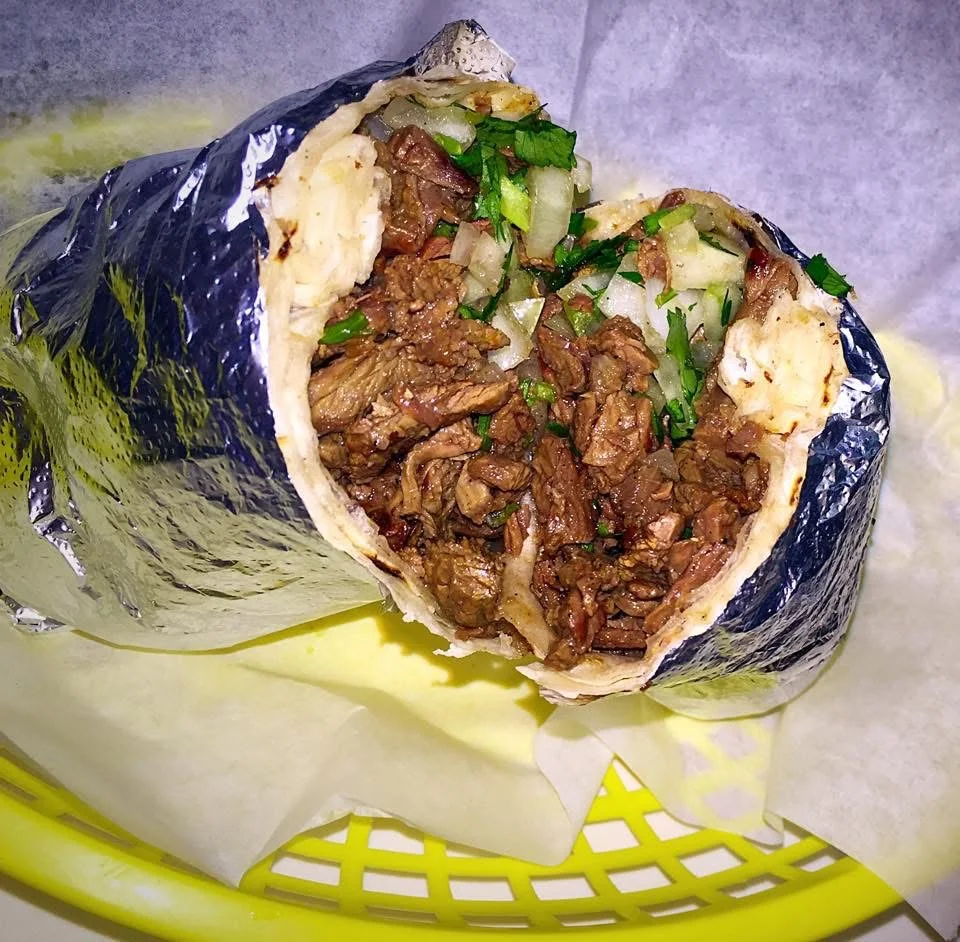 Authentic Mexican carne asada burrito wrapped in foil