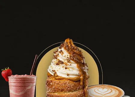 Delicious dessert with whipped cream, caramel, and drinks on a dark background.