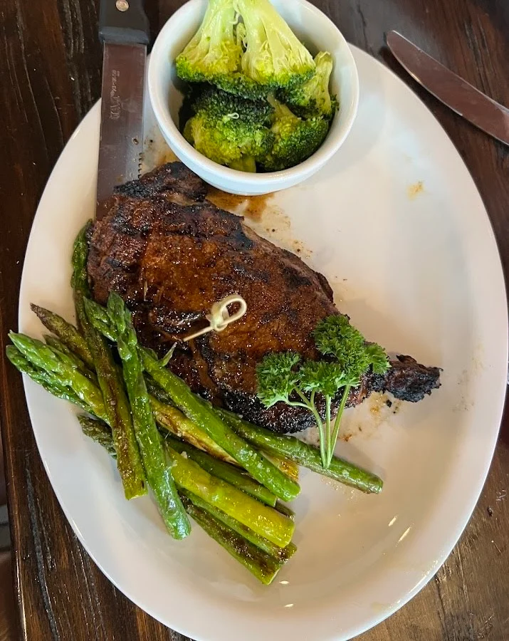Grilled ribeye steak with asparagus and broccoli