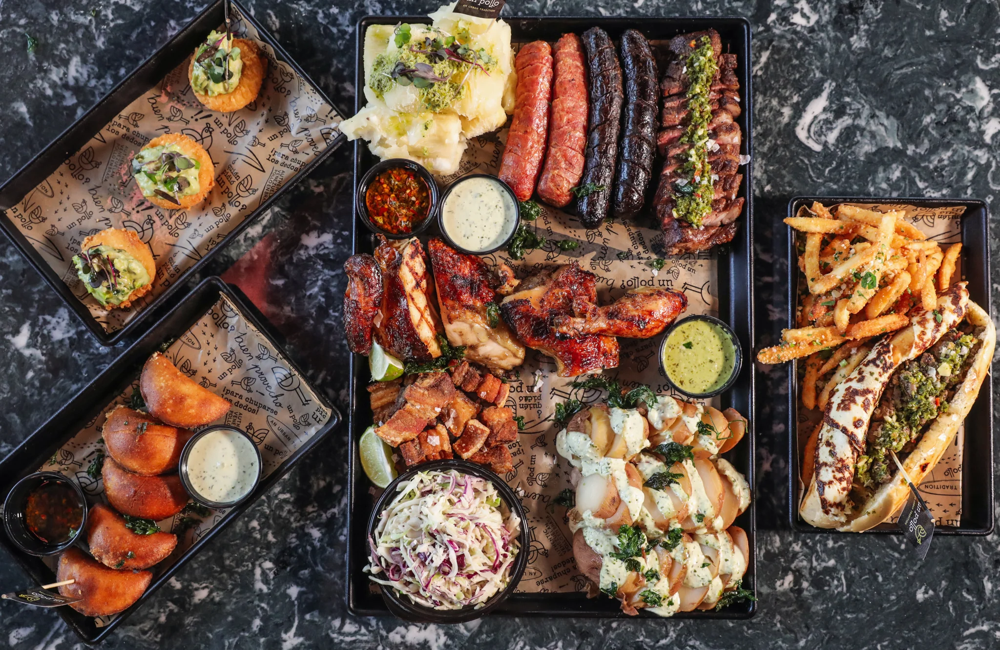 Assorted Latin American barbecue platter with meats and sides