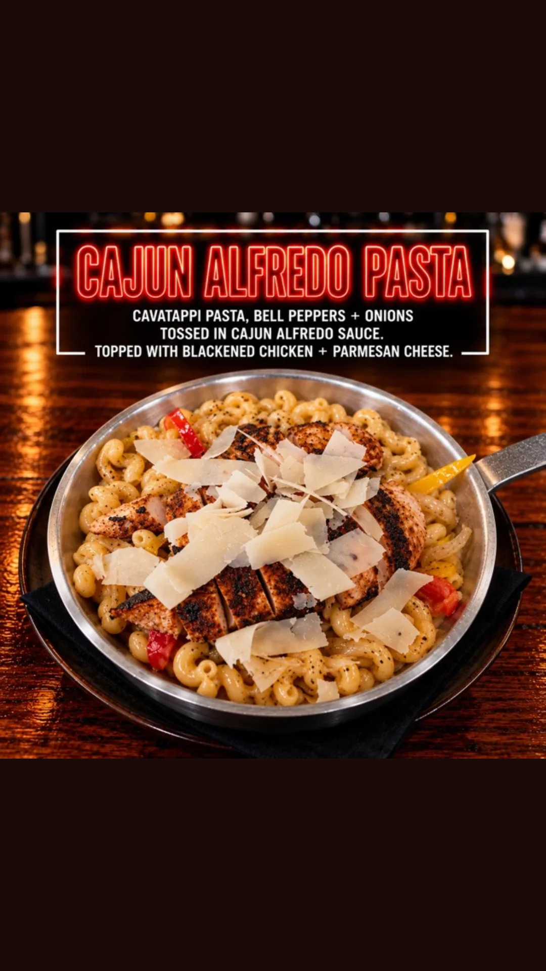 Cajun alfredo pasta with blackened chicken in a skillet