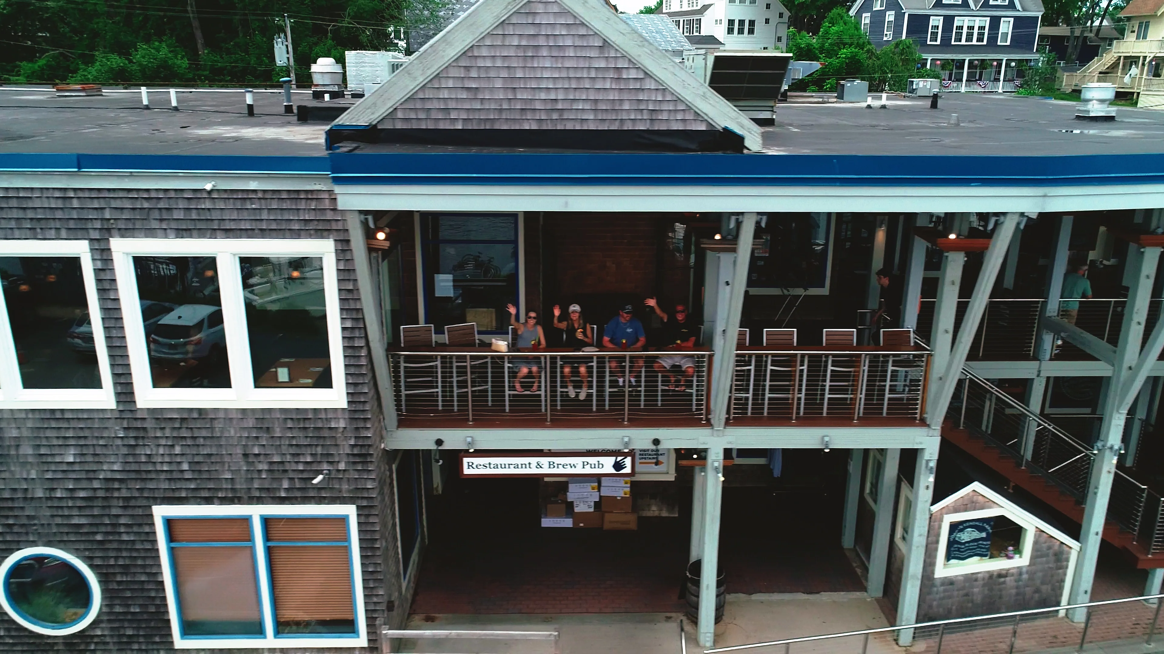 Outdoor dining area of a restaurant and brew pub with guests