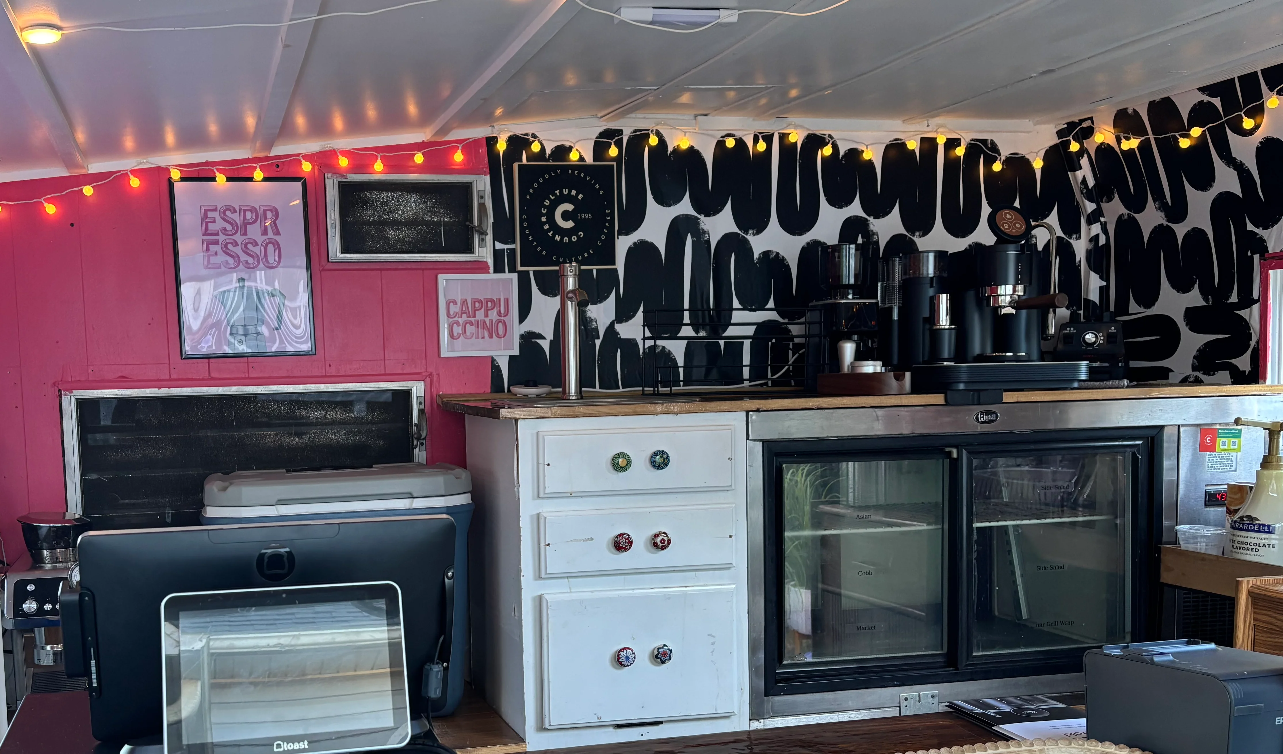 Colorful coffee shop interior with espresso equipment