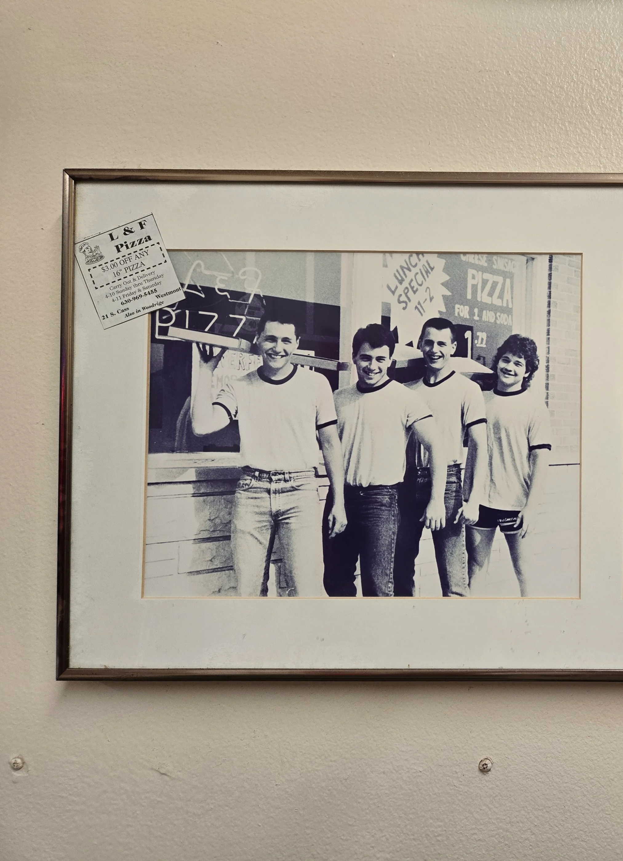 Vintage photo of pizza restaurant staff posing outside