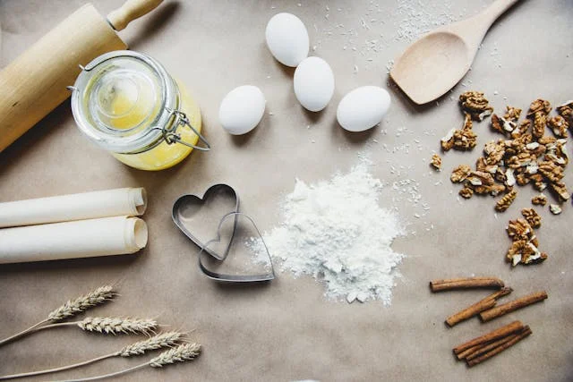 Baking ingredients for homemade cookies on a wooden table