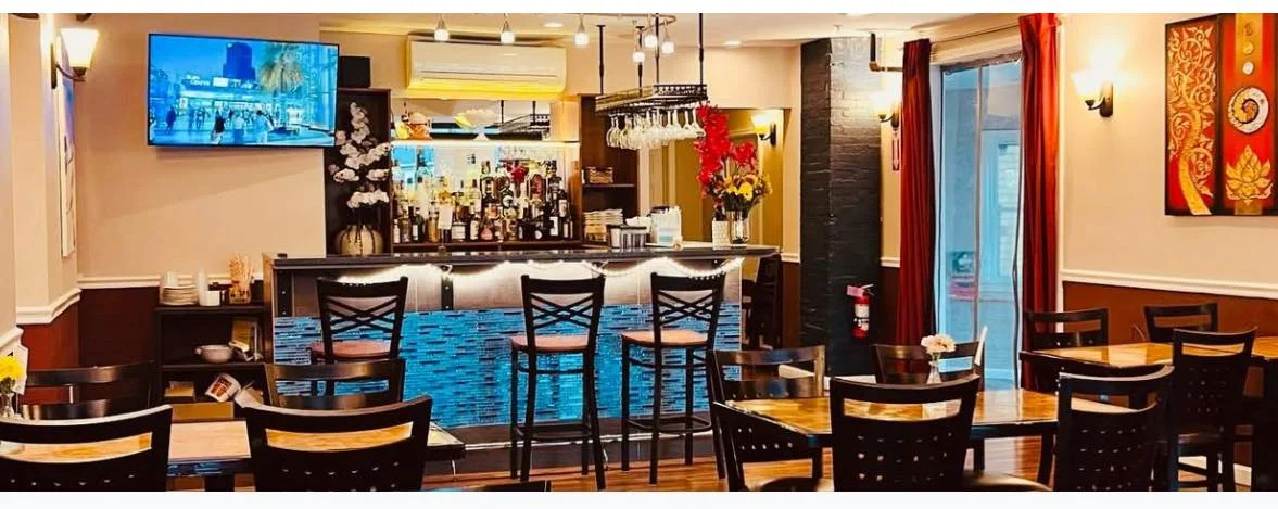 Cozy restaurant interior with a modern bar and warm lighting