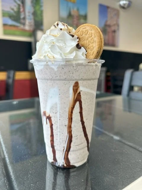 Creamy cookies and cream milkshake topped with whipped cream