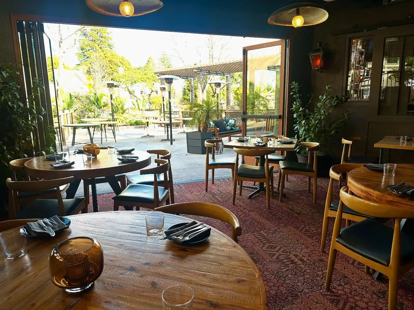 dining area open to the outdoor patio