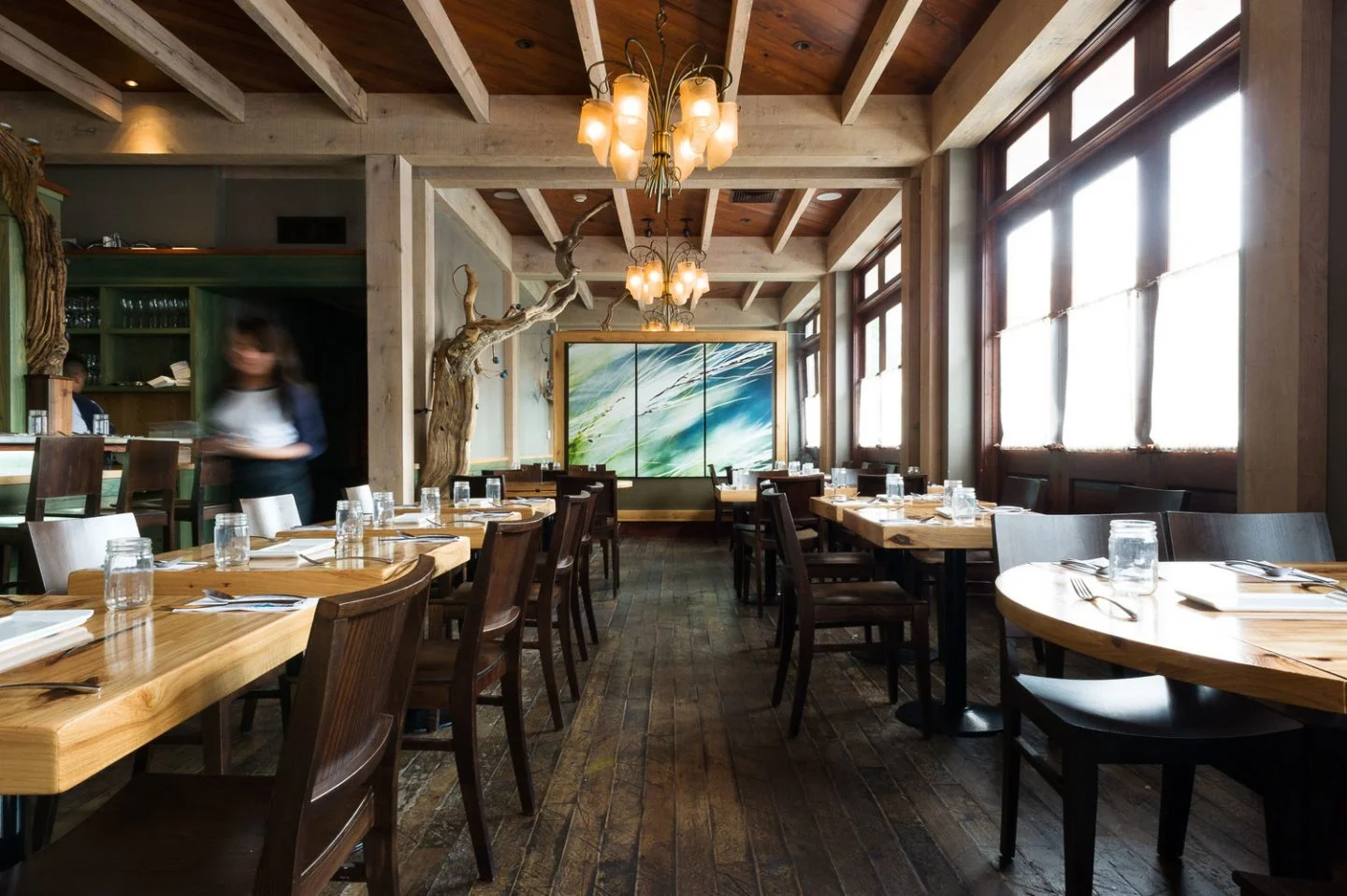 Cozy restaurant interior with wooden decor and natural lighting
