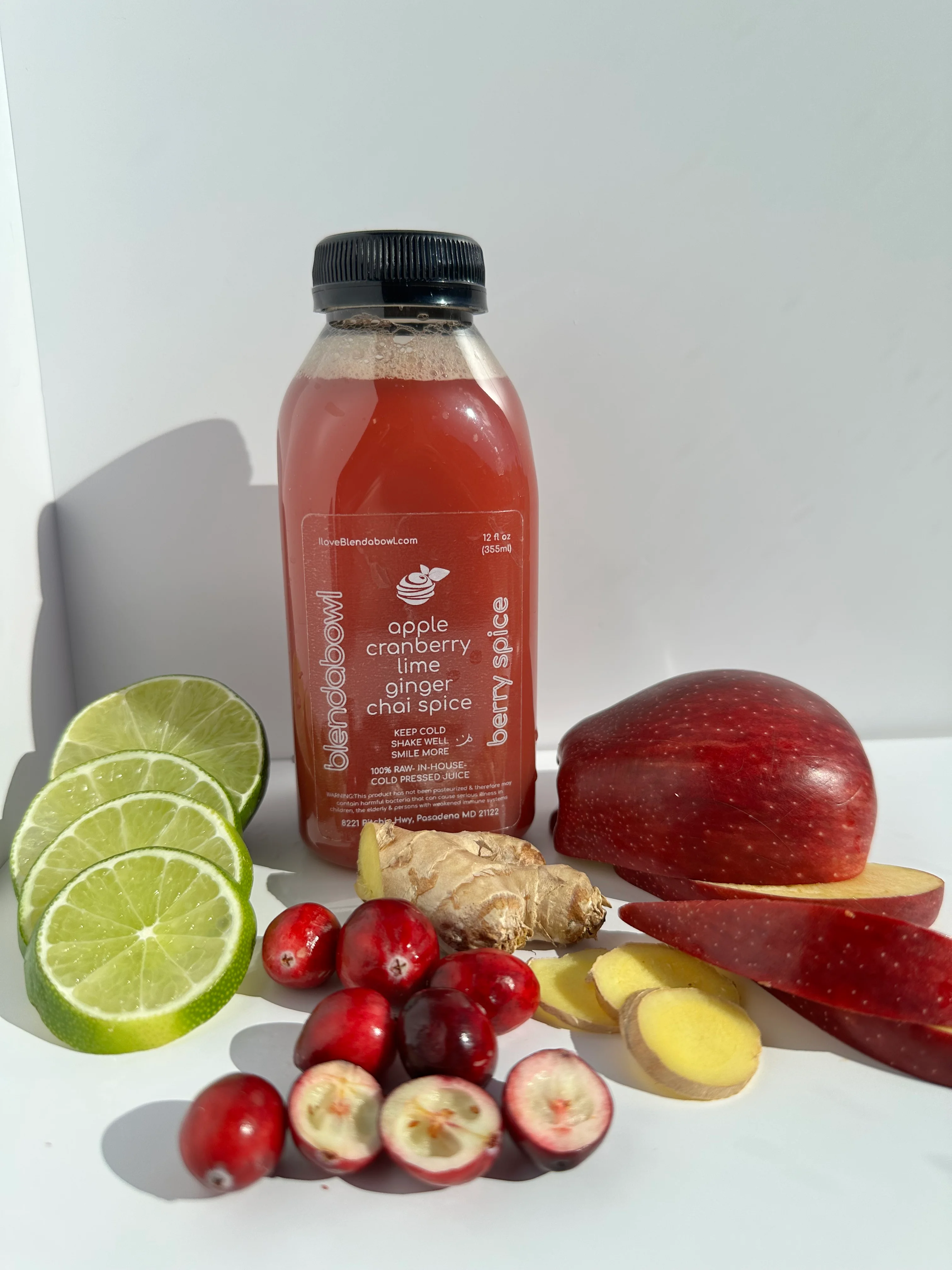 berry spice juice with ingredients laying around it