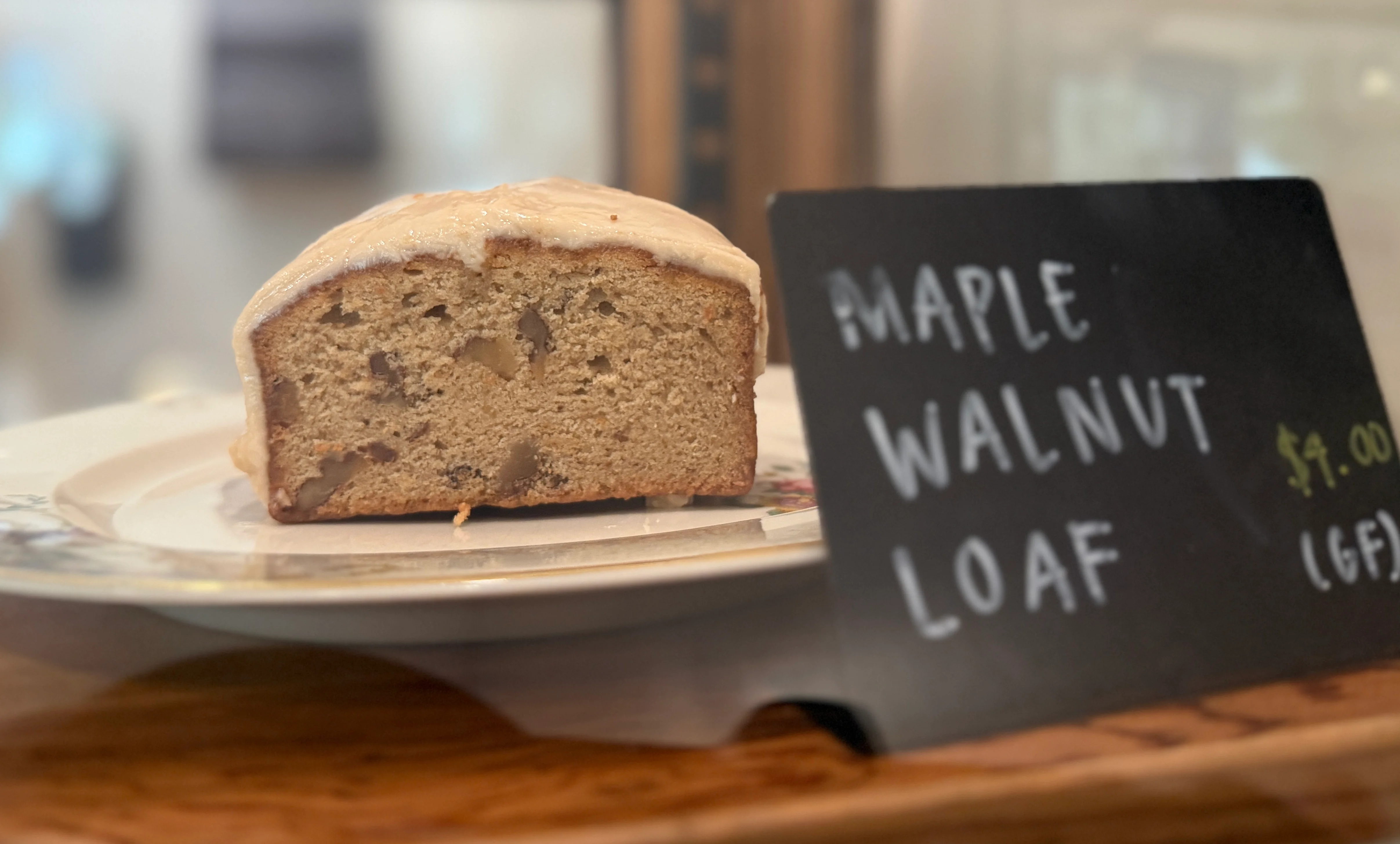 Gluten-free maple walnut loaf on a decorative plate