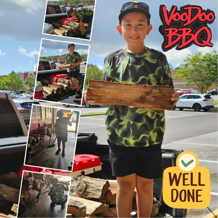 Young helper stacking oak and pecan wood used for VooDoo BBQ’s slow-smoked meats in Pensacola.