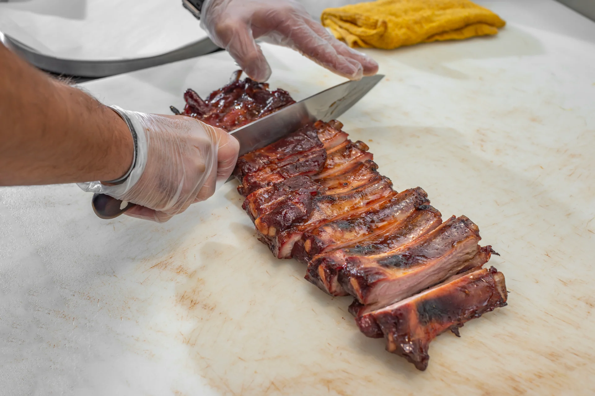 Sliced barbecue ribs on a cutting board