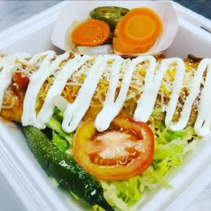 Delicious enchilada served with fresh toppings