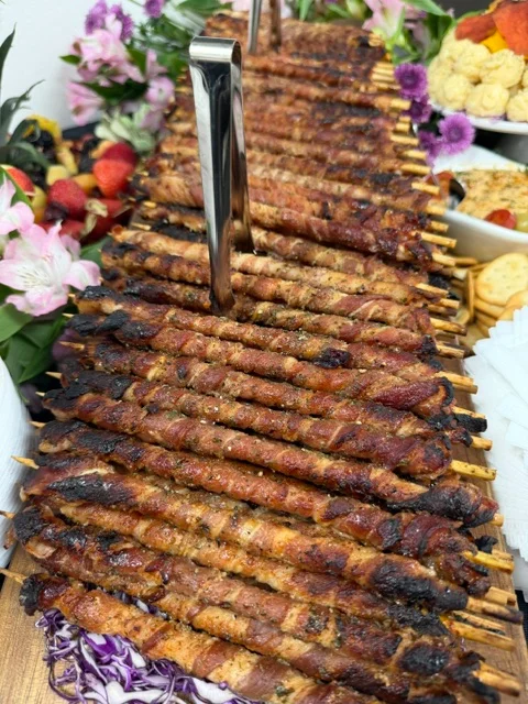 Grilled kebabs served on skewers, showcasing Middle Eastern cuisine