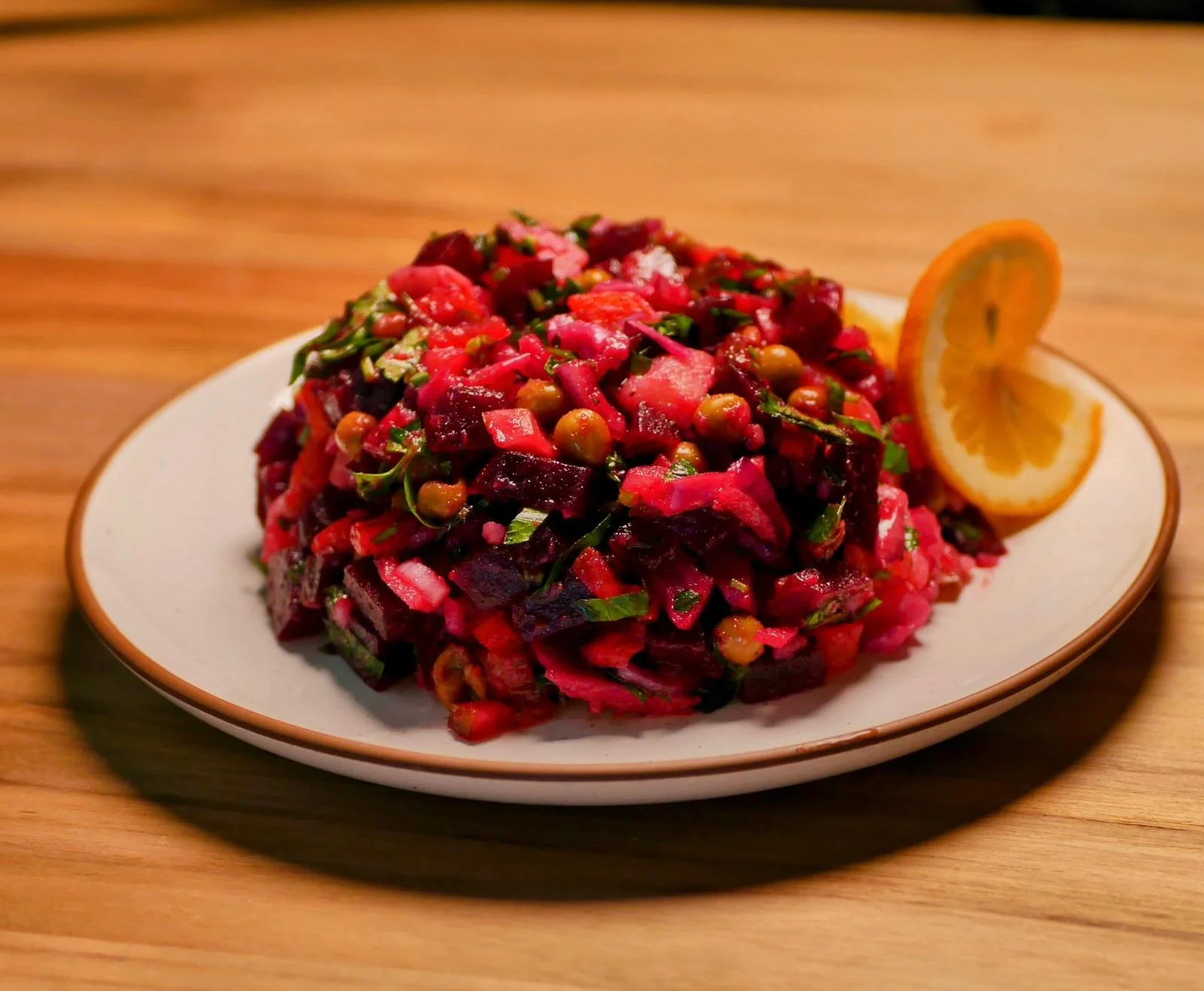 Colorful Russian beet salad with herbs and lemon