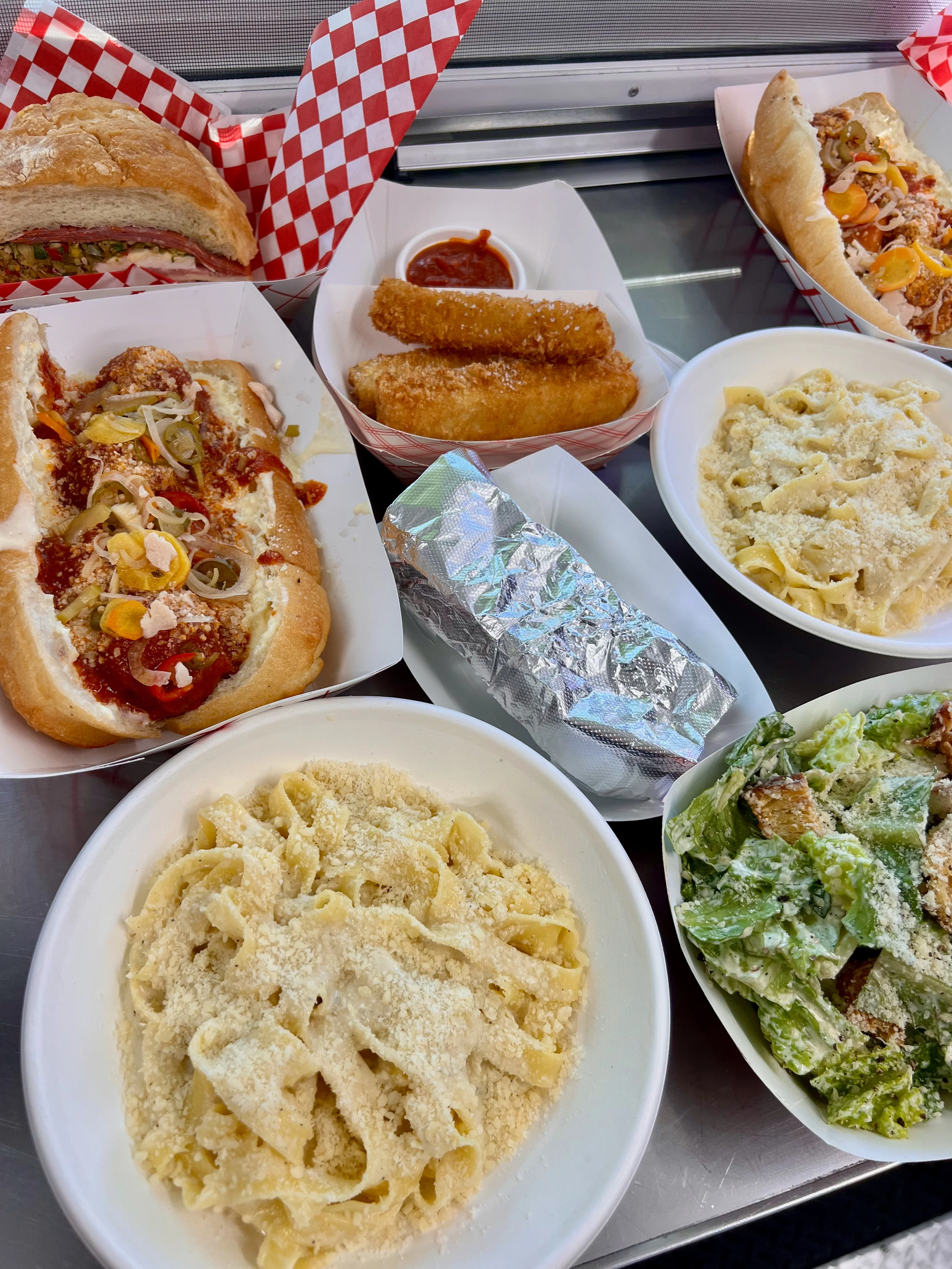 Italian fettuccine alfredo with garlic bread and assorted appetizers