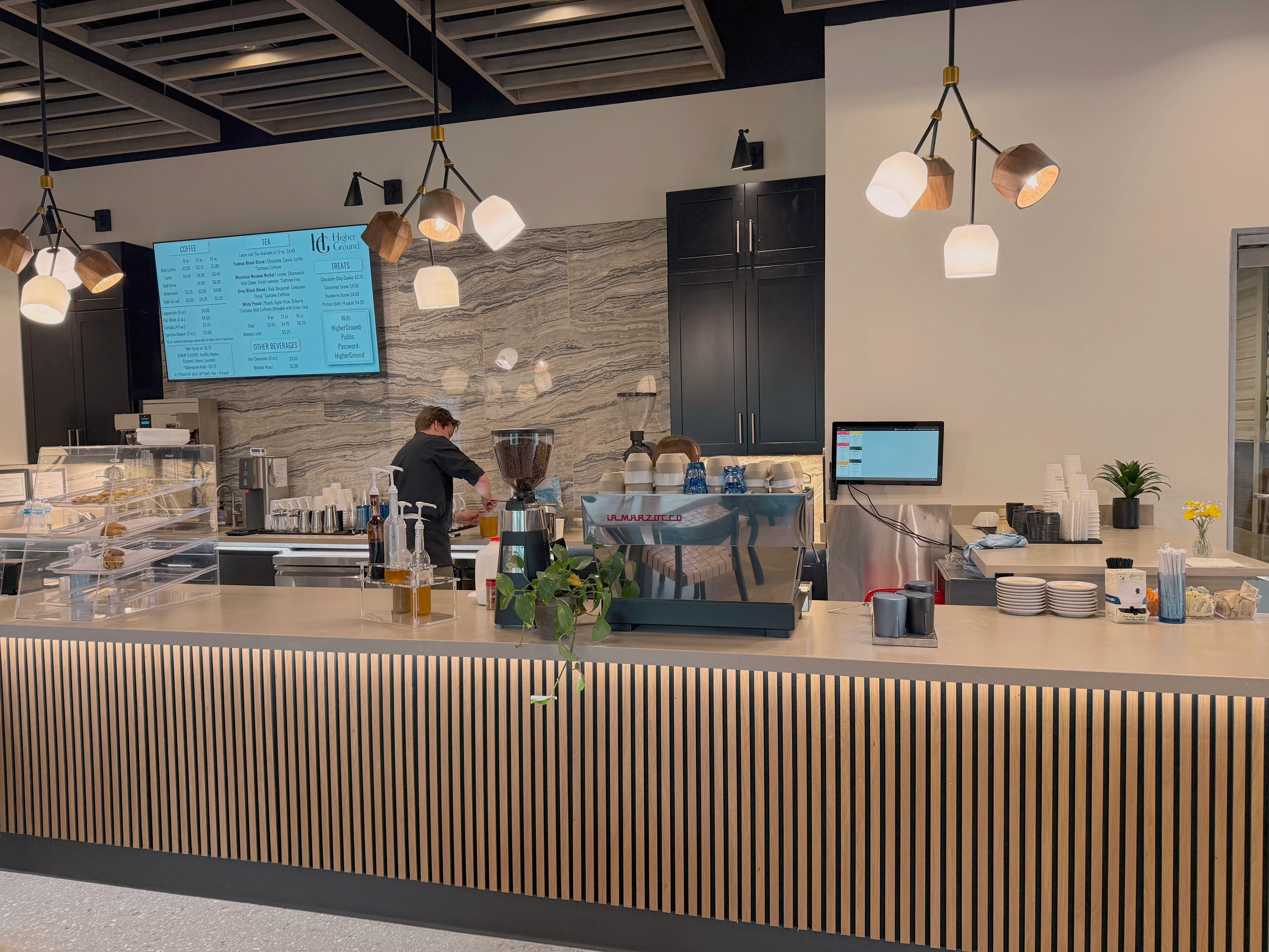 Modern café interior with stylish decor and menu display