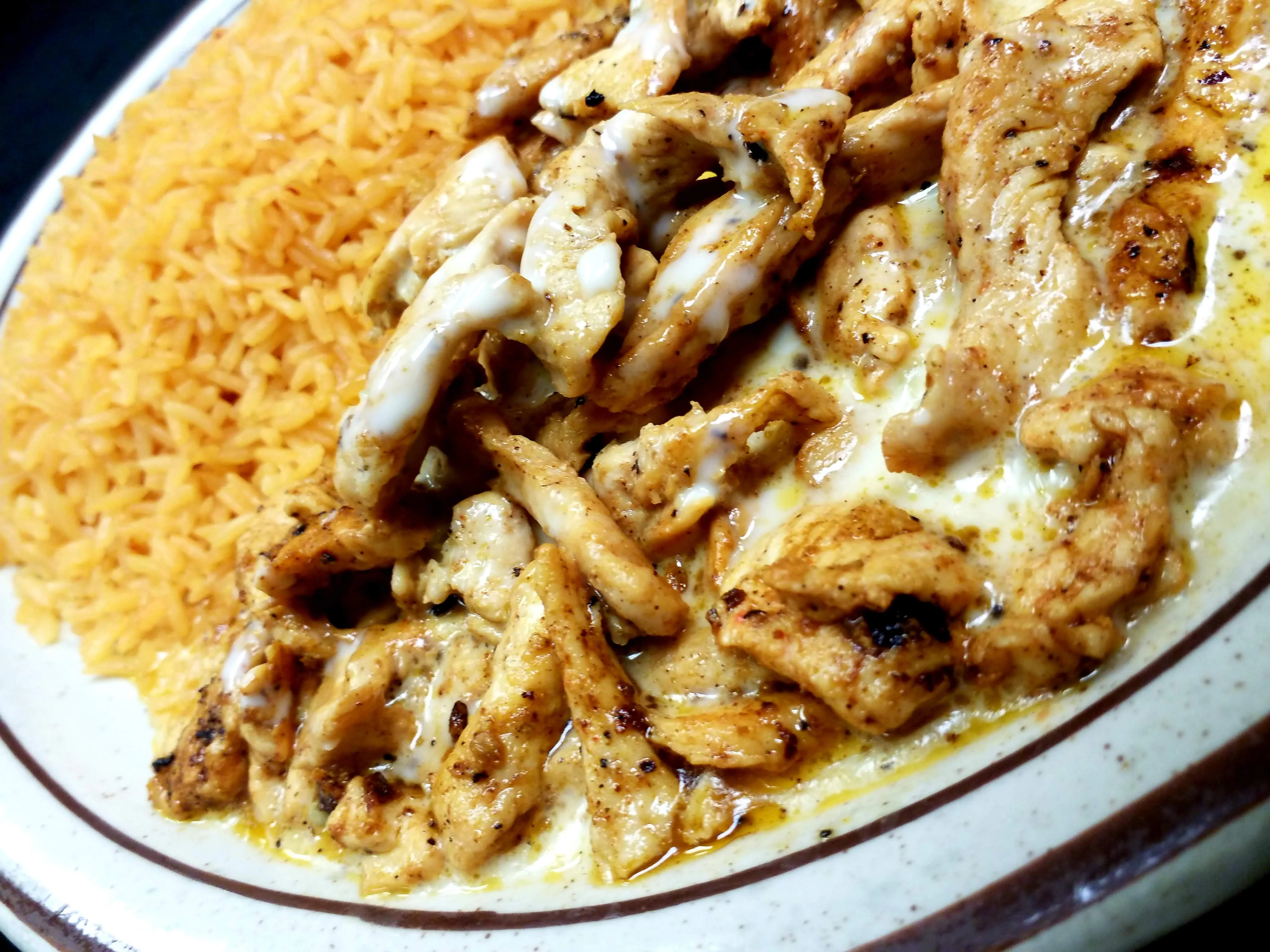 Savor the authentic taste of our Arroz con Pollo. The best Arroz con Pollo in Radford. This dish features tender grilled chicken smothered in rich, melted queso, served atop a bed of flavorful Mexican rice. Each bite offers a harmonious blend of textures and flavors that capture the essence of traditional Mexican cuisine. A satisfying meal that’s a favorite among our patrons.